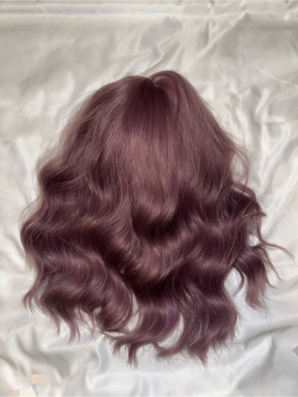 NWOT short wavy wig in a muted dusty mauve/purple shade cosplay